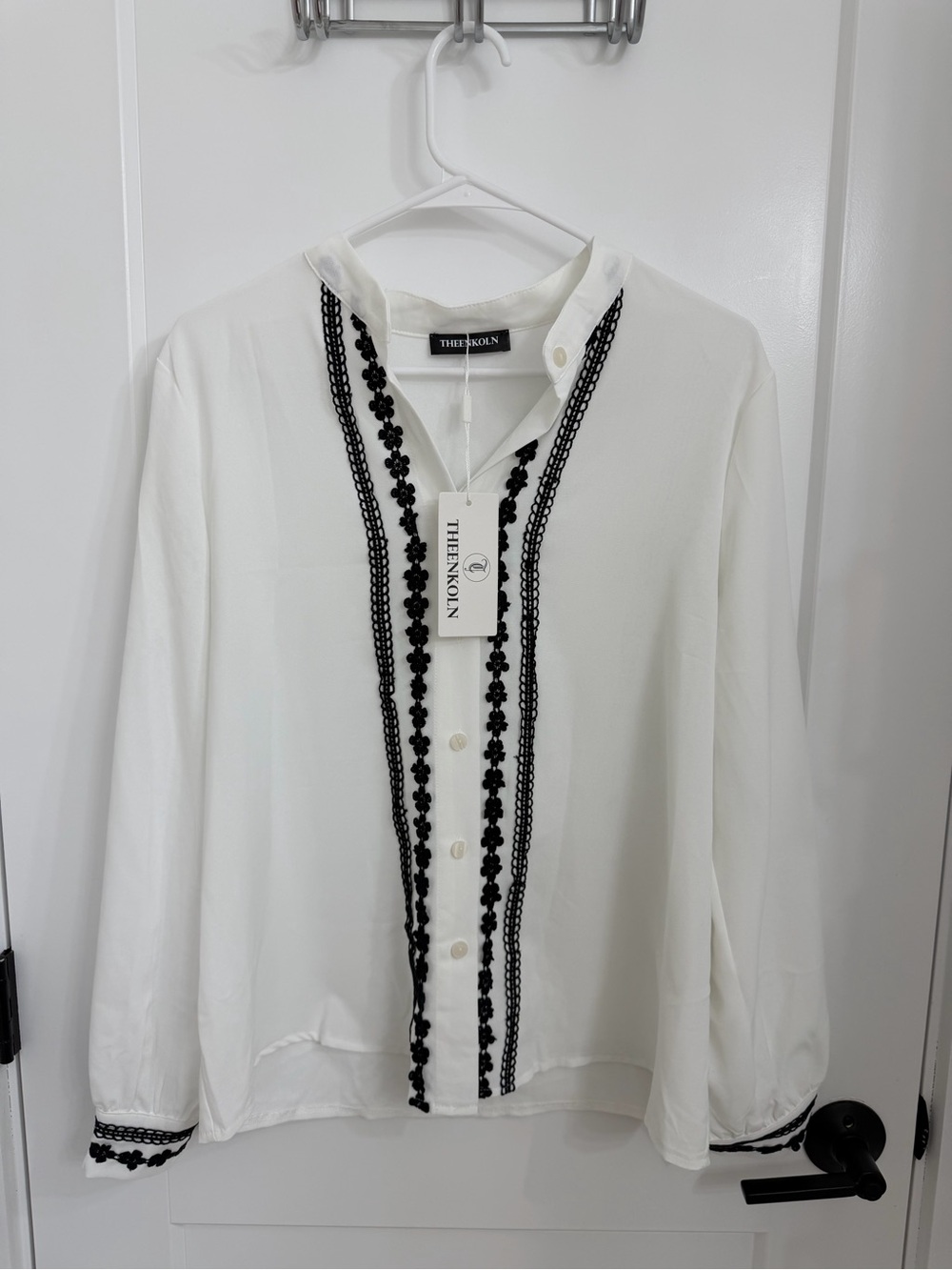 The Enkoln White Button-Front Blouse with Black Trim